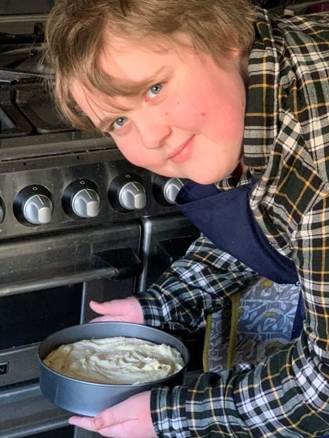 putting cake in oven